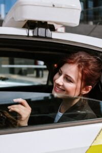 Woman enjoying outside view with dial a driver auckland