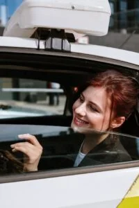 Woman enjoying outside view with dial a driver auckland