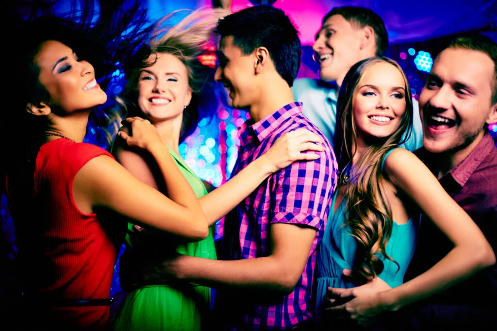 Group dancing and enjoying - dial a driver auckland