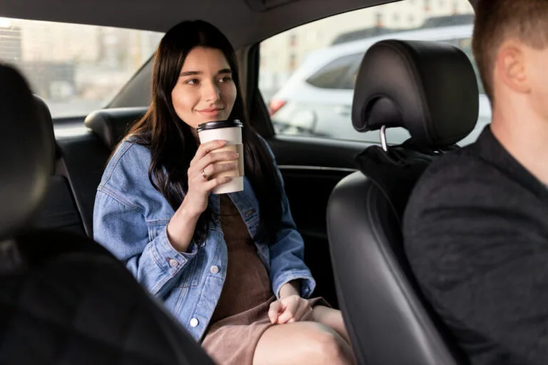 dial a driver cover - woman enjoying ride backseat